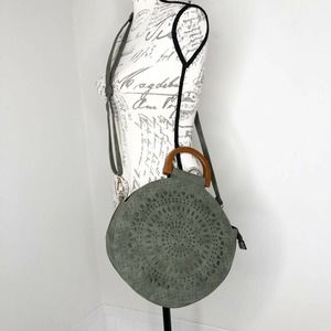 Circular Olive Faux Suede Handbag Wood Handles Laser Cut Design Crossbody Strap